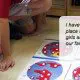 a child using Montessori metal insets to prepare for writing tasks