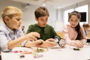 happy children building robots at robotics school