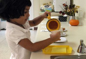 Child pouring water