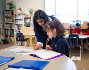 students learning to tell time using Montessori clock materials